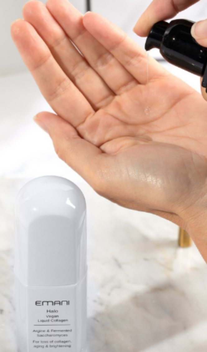 A person applying Emani Halo Vegan Liquid Collagen to their palm, showcasing a skincare product designed to improve collagen production, reduce aging signs, and enhance skin brightness.