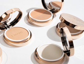 Collection of Emani vegan, clean beauty pressed powders in elegant gold compact packaging, designed for flawless coverage, skin health, and anti-aging benefits.