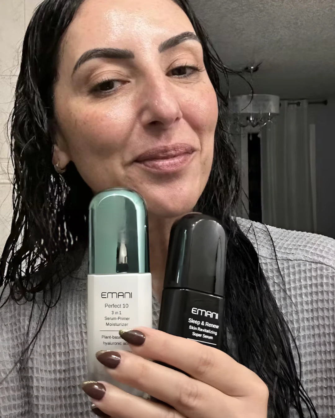 Woman holding Emani skincare products in front of a mirror | Raysa Perez